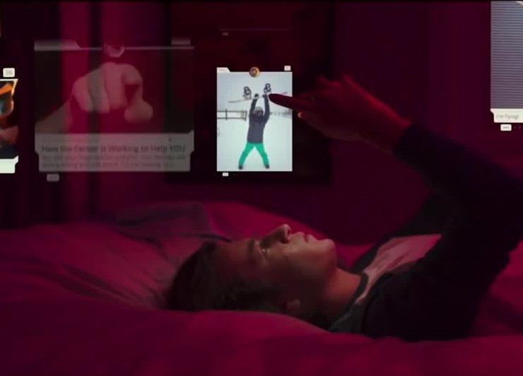 An artist with headphones and a smartphone streams music from a popular streaming service, highlighting the impact of streaming on the music industry